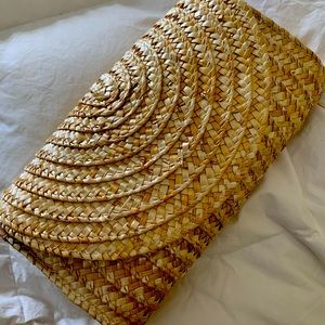 Straw clutch with fabric lining and magnet closure